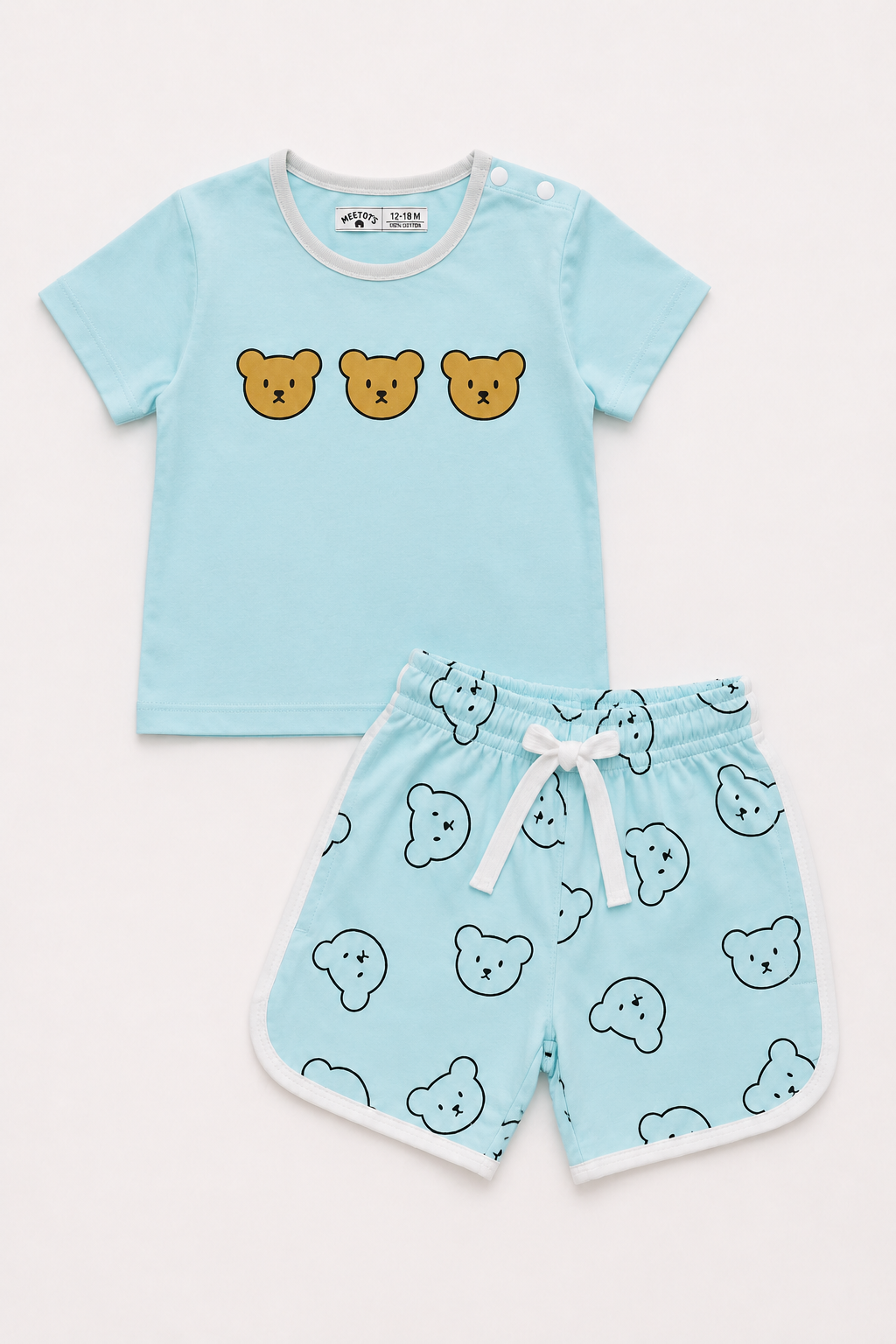 A baby two-piece clothing set featuring a light blue short-sleeve t-shirt with three cartoon bear faces on the chest, and matching light blue shorts with a white bear print, white trim, and a white drawstring.