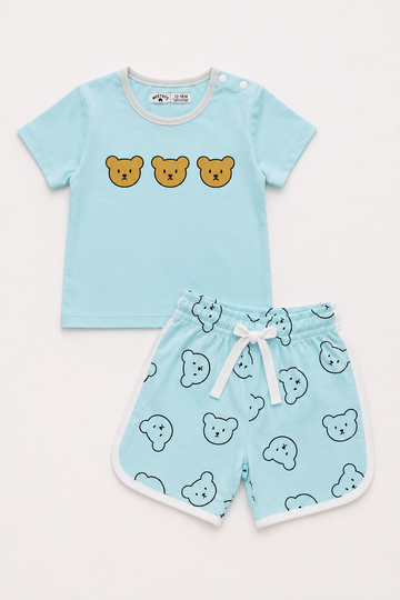 A baby two-piece clothing set featuring a light blue short-sleeve t-shirt with three cartoon bear faces on the chest, and matching light blue shorts with a white bear print, white trim, and a white drawstring.