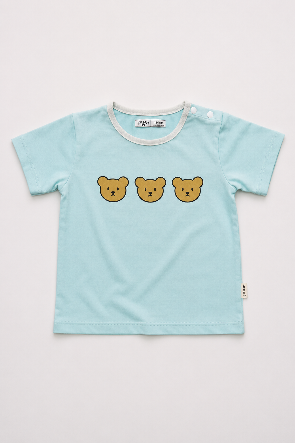 A light blue short-sleeve baby t-shirt with three embroidered teddy bear faces across the chest, displayed flat against a light gray background.
