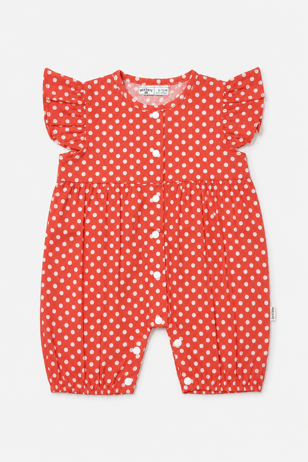 A baby romper in red with a white polka dot pattern, featuring ruffled sleeves and snap closures down the front, shown on a light gray background.
